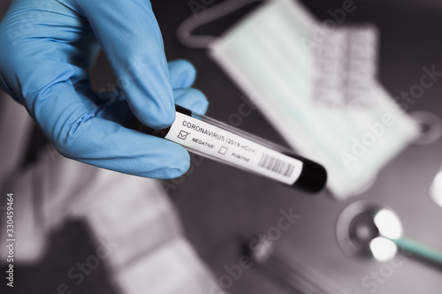 Coronavirus blood test positive. Doctor holding a test tube. 2019-nCoV. Covid.