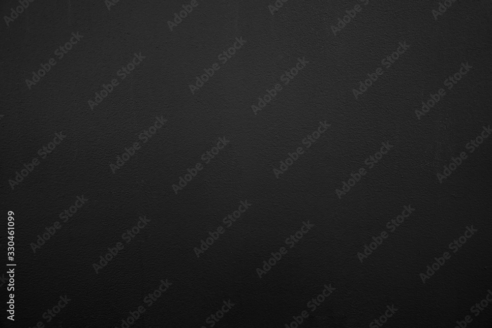 Abstract black background. Black stucco texture. Dark rough surface.