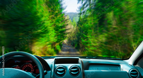 Obraz na płótnie car in the forest. motion blur landscape with interior view w salonie