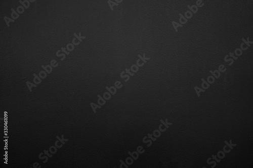 Abstract black background. Black stucco texture. Dark rough surface.