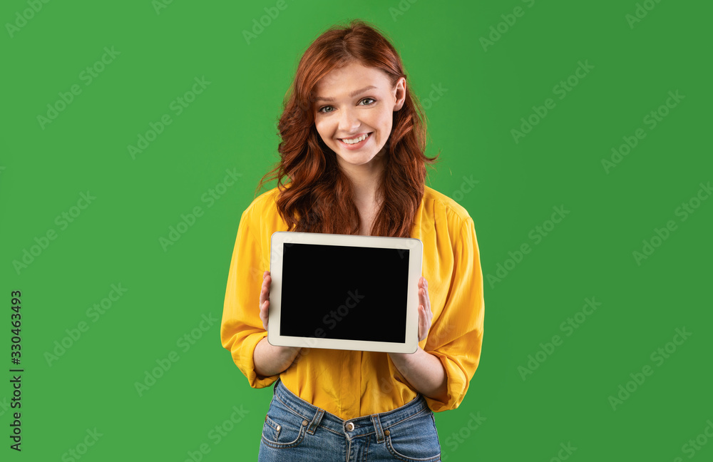 Student Girl Showing Tablet Blank Screen Posing On Green Background Student Girl Showing Tablet Blank Screen Posing On Green Background
