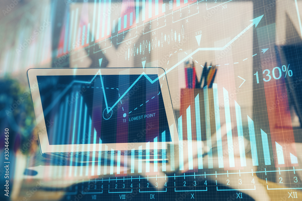 Financial graph colorful drawing and table with computer on background. Multi exposure. Concept of international markets. Financial graph colorful drawing and table with computer on background. Multi exposure. Concept of international markets.