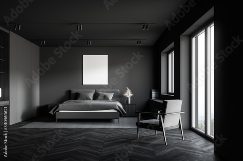 Gray master bedroom with poster and armchair