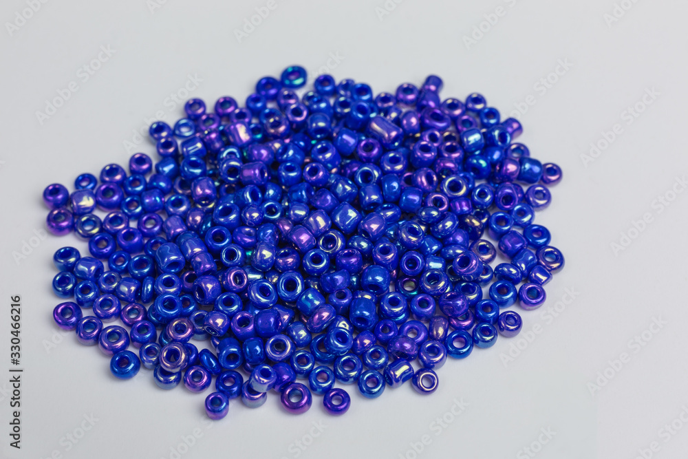 heap with tiny blue iridescent glass beads for embroidery heap with tiny blue iridescent glass beads for embroidery