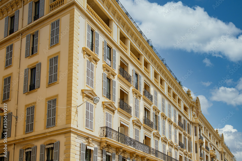 A large yellow building in classic architecture in Nice, France