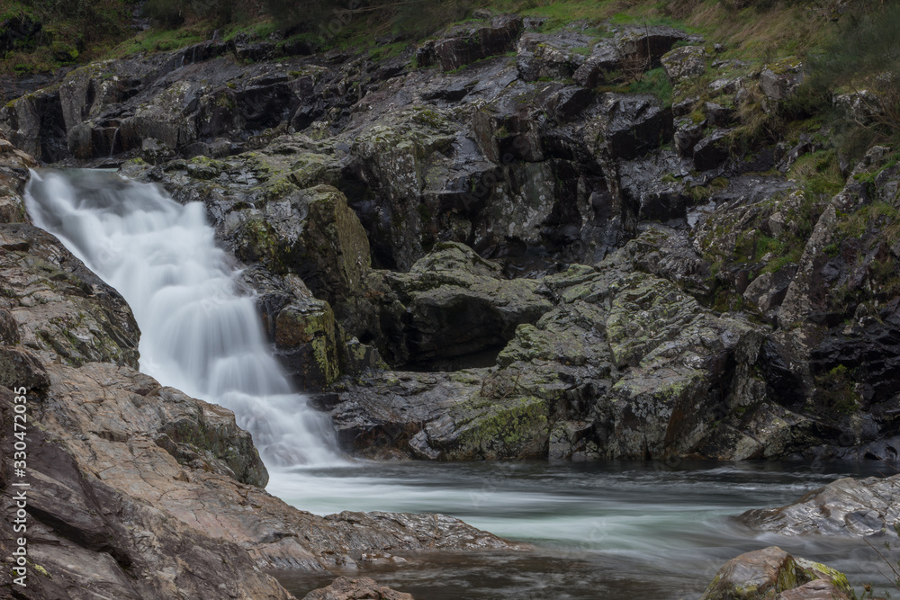 Beautiful waterfall in Fisgas de Ermelo in winter, Mondim de Basto, Vila Real, Portugal Beautiful waterfall in Fisgas de Ermelo in winter, Mondim de Basto, Vila Real, Portugal