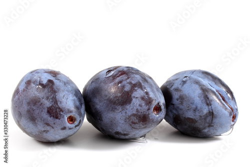 Three blue plums