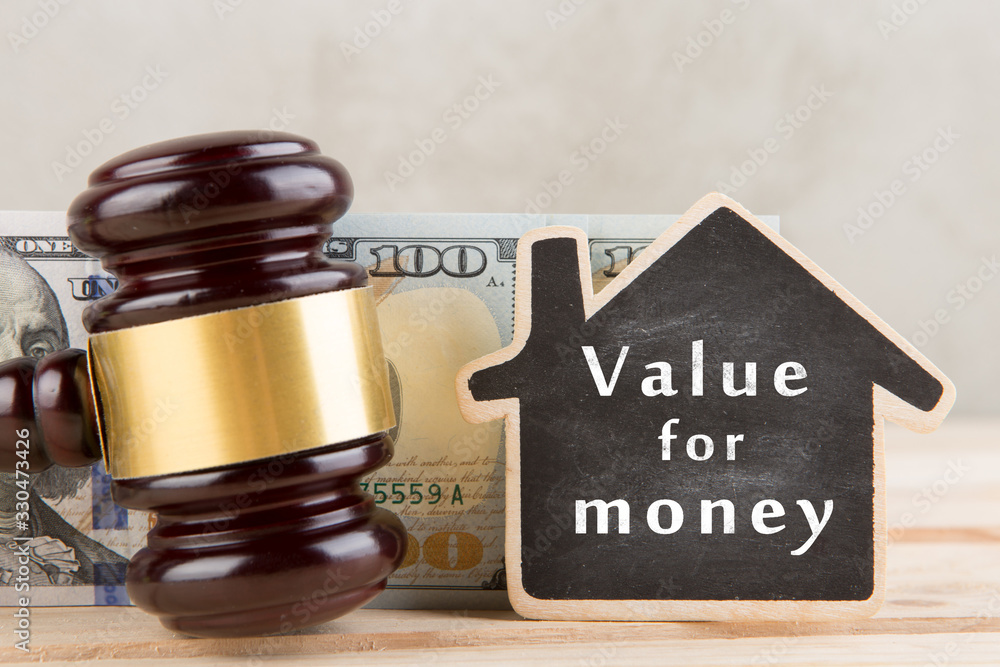 Real estate concept - Value for money, gavel and house model