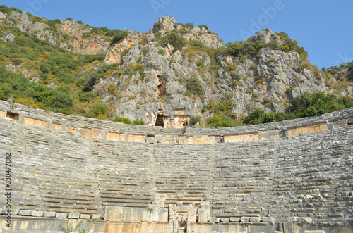 Ancient architecture in Demre. Turkey. Lycian necropolis with tomb carved in rocks in Mira photo