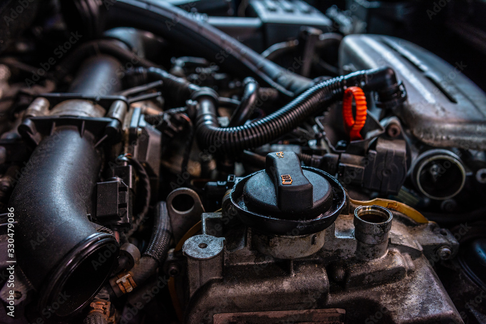 closeup of car turbo engine with oil filler neck for lubrication of internal parts and turbine
