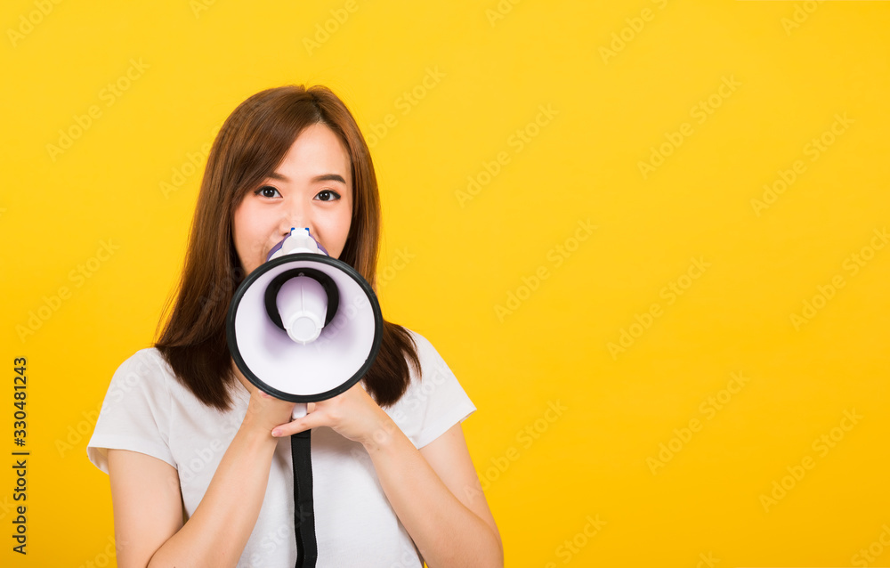 woman teen standing making announcement message shouting screaming in megaphone woman teen standing making announcement message shouting screaming in megaphone