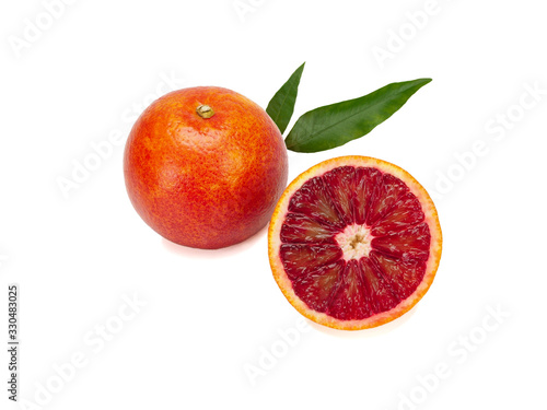 Red blood orange with leaf isolated on a white background