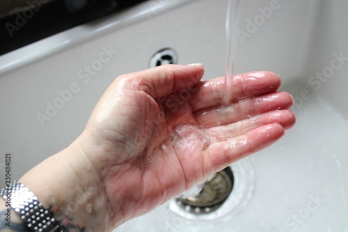 washing hands in soap and water