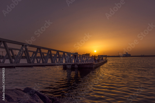 Evening scene of a seaside pier bridge of Muscat  Oman during sunset or dawn. 