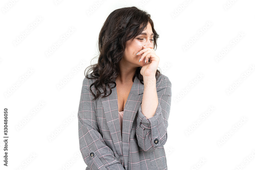 girl in a classic checkered gray jacket asks for forgiveness on a white background girl in a classic checkered gray jacket asks for forgiveness on a white background