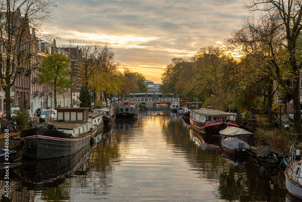 canal in amsterdam sunset