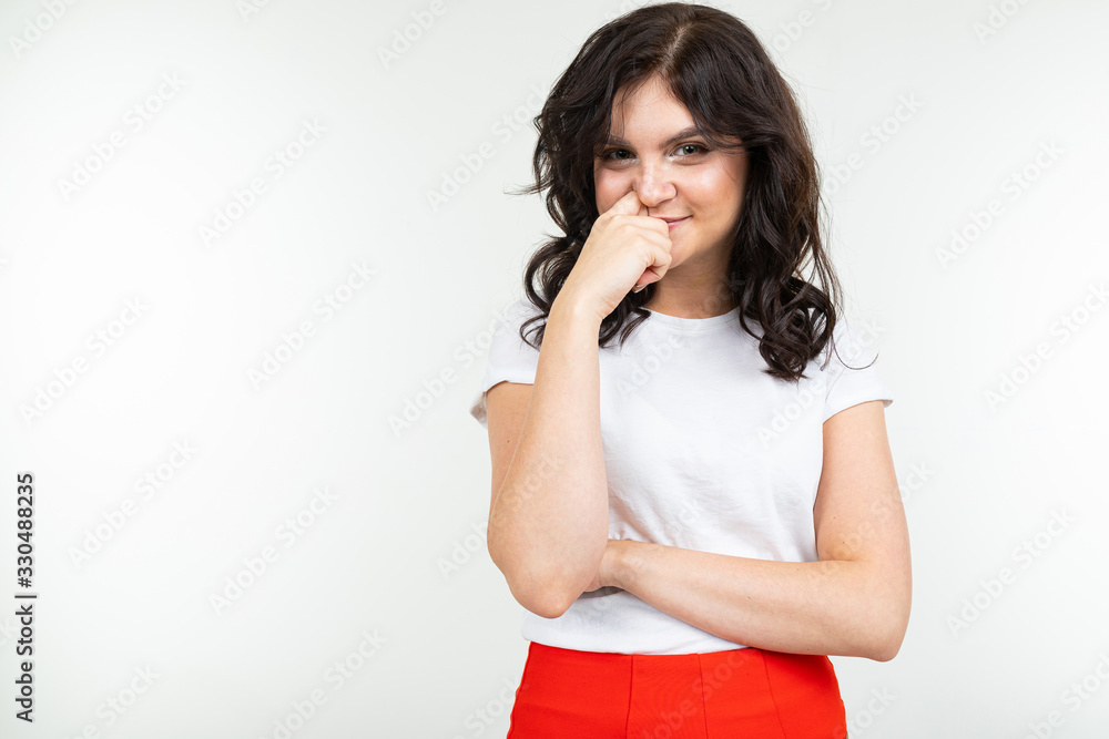 pretty brunette in white t-shirt and red pants isolated on white background pretty brunette in white t-shirt and red pants isolated on white background