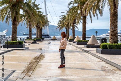 happy woman looking at sea in Montenegro