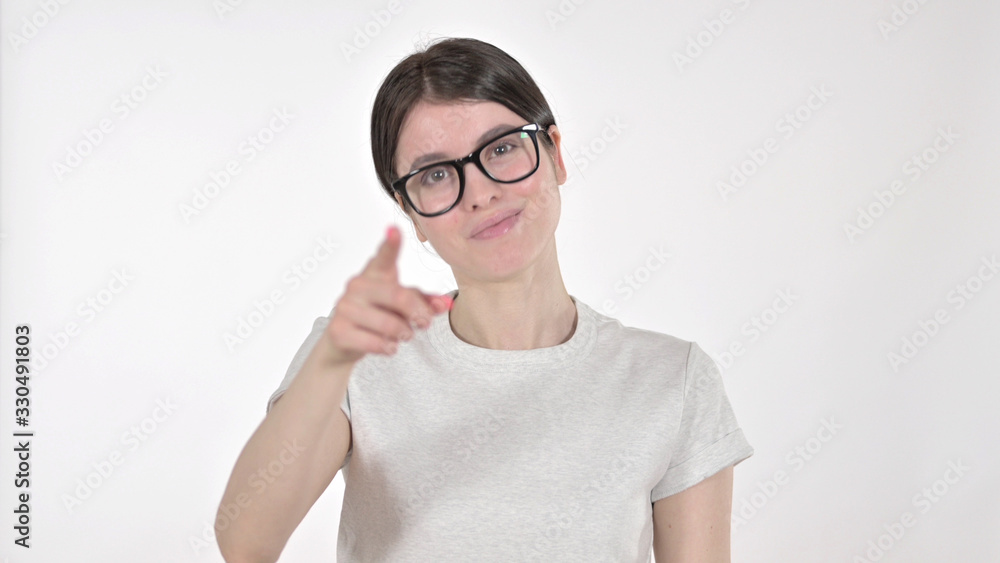 The Focused Young Woman Pointing Finger on White Background The Focused Young Woman Pointing Finger on White Background