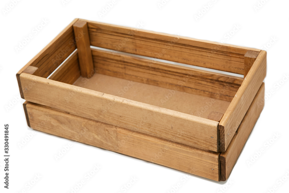 A rectangular box of light-colored boards. Isolated. A rectangular box of light-colored boards. Isolated.