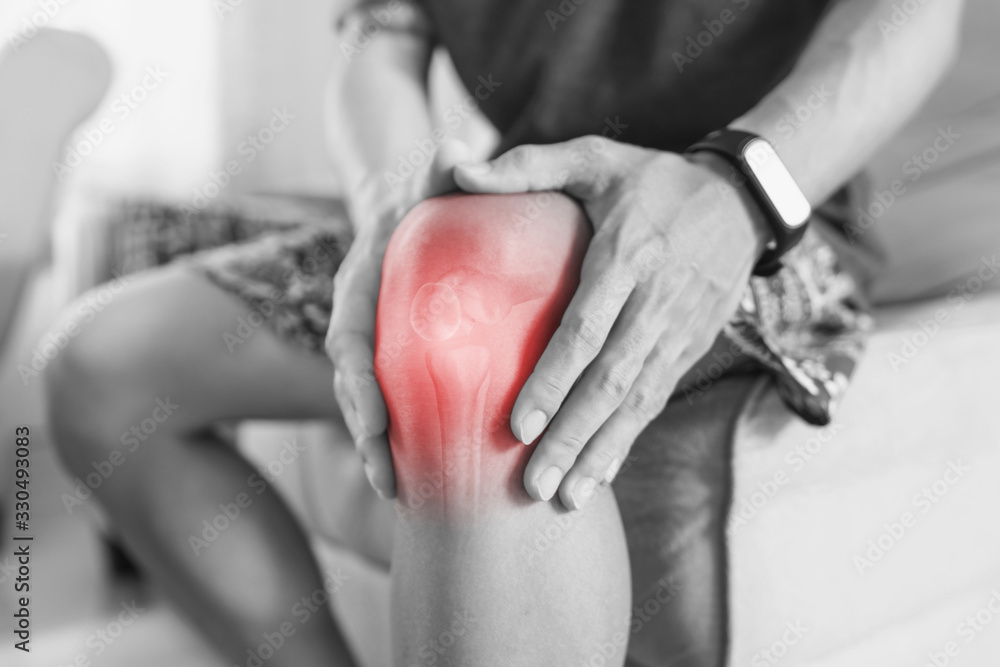 Joint pain, Arthritis and tendon problems. a man touching nee at pain point	
