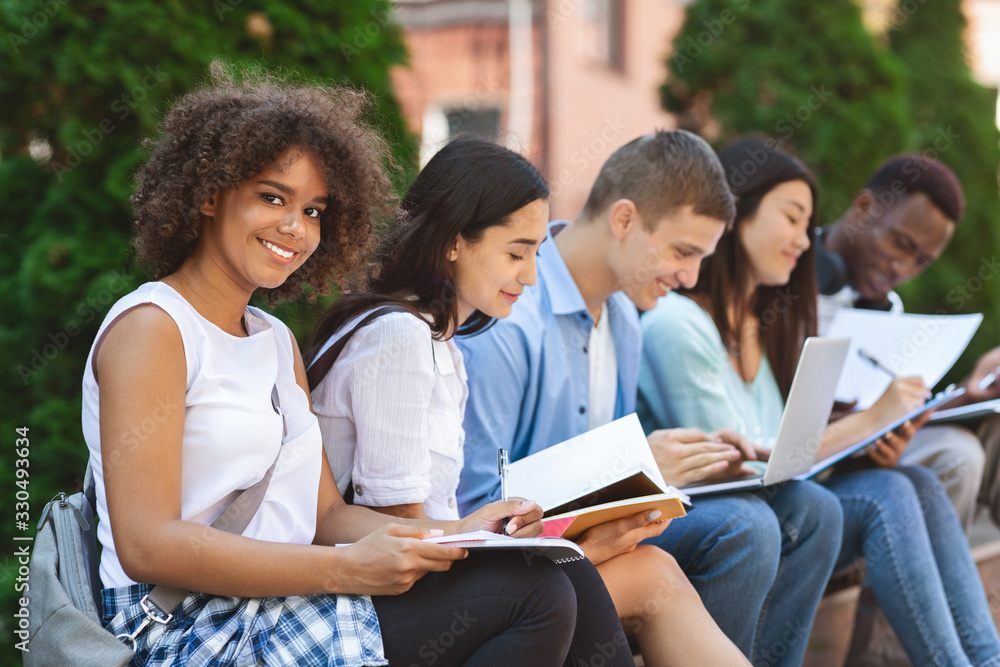 Black Student Girl Preparring For Exams Outdoors With Her University Friends Black Student Girl Preparring For Exams Outdoors With Her University Friends