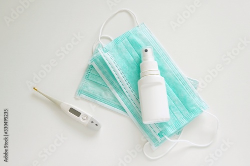 Coronavirus prevention  protective medical mask  disinfection spray  thermometer  protection measures.