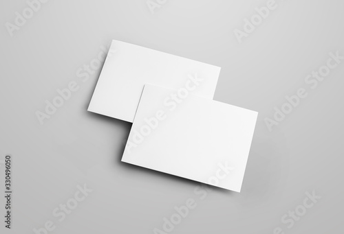 Business folding bifold template isolated on gray background, with realistic shadows.