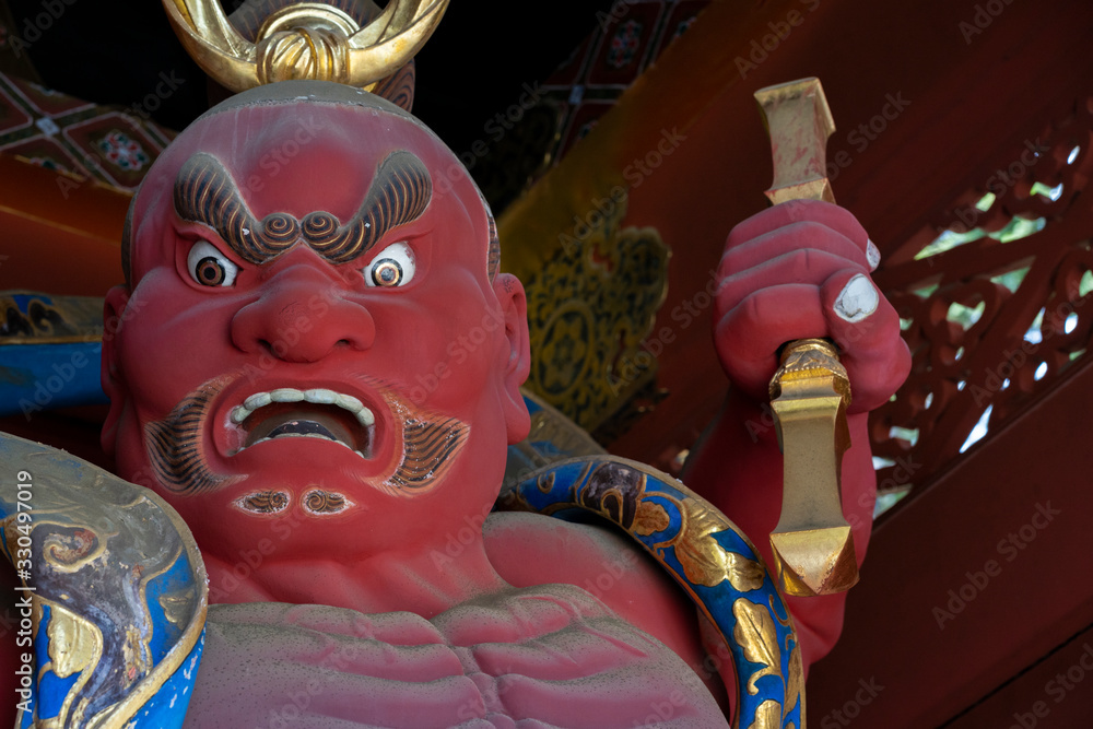 Red buddhist Nio warrior Statues, at Niomon Gate of Taiyuinbyo Shrine