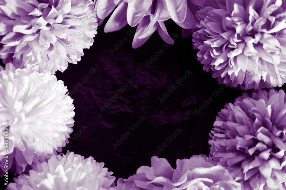 Obraz premium Beautiful abstract color blue pink and purple flowers on black background and blue graphic white flower frame and pink leaves texture, purple background, colorful graphics banner 