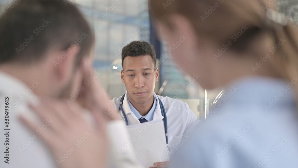 The Upset Couple Sitting in Front of African Young Doctor The Upset Couple Sitting in Front of African Young Doctor