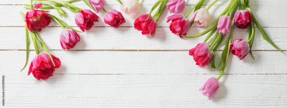 red tulips on white wooden background red tulips on white wooden background