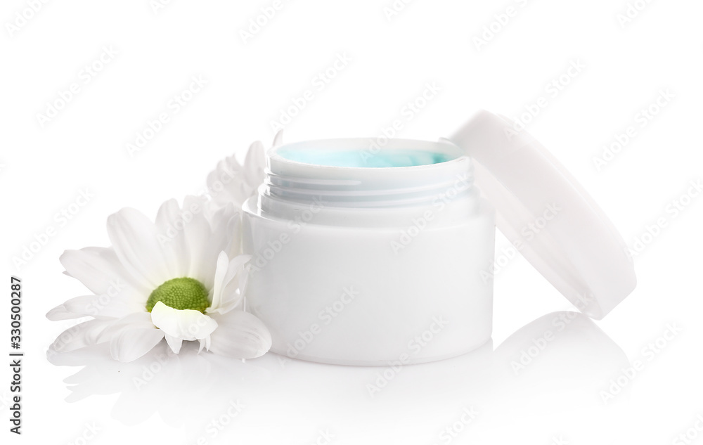Natural cream in jar with flower isolated on white background Natural cream in jar with flower isolated on white background