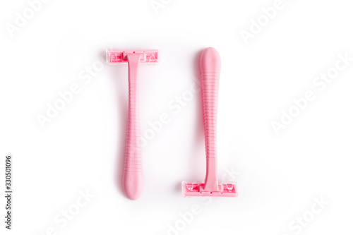 Pink razor isolated on a white background photo