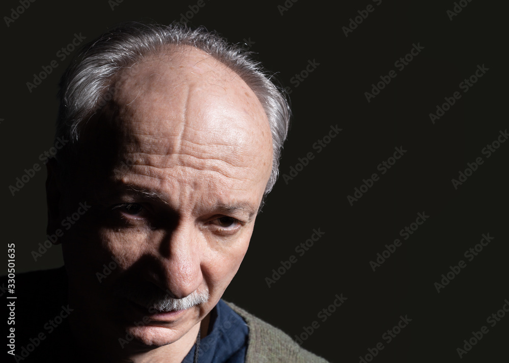 elderly man looks skeptically elderly man looks skeptically