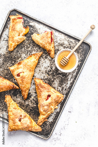 Nectarine and rasberry turnovers photo