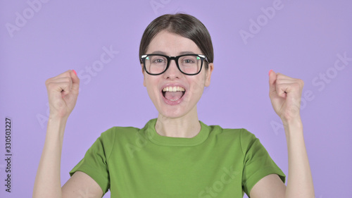 The Young Woman Celebrating with both Fest on Purple Background