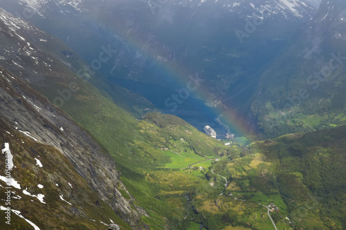 Stranda, Norway - June 4, 2019. A rainbow view from Dalsnibba view point towards the Geiranger village harbor. 