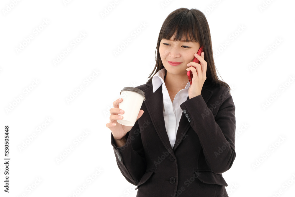 Smiling Young Asian business woman in black suit with long hair holding A cup of coffee and talking on the phone on white background,studio isolated. Smiling Young Asian business woman in black suit with long hair holding A cup of coffee and talking on the phone on white background,studio isolated.