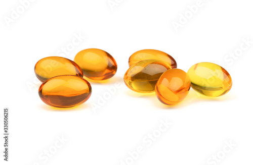 Omega 3 fish oil capsules on  the White Surface. Closeup