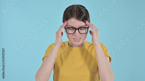 The Stressed Young Woman Having Headache on Purple Background