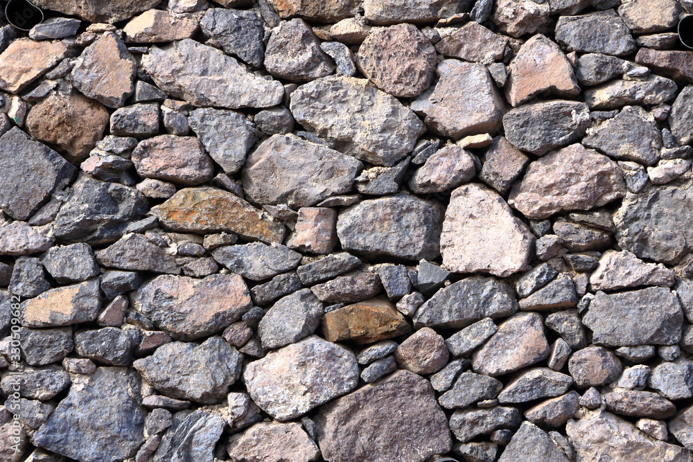 Texture of a grey granite stone wall for background Texture of a grey granite stone wall for background