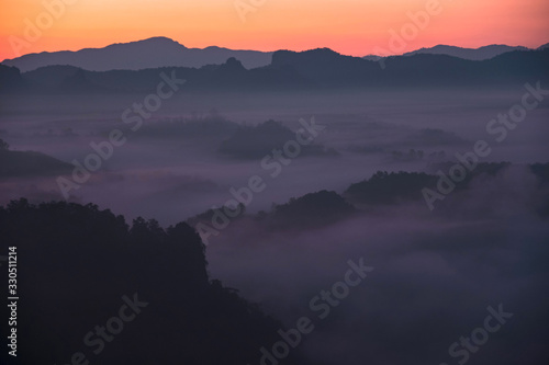 The morning mist Thailand mountains covered with fog sunrise time