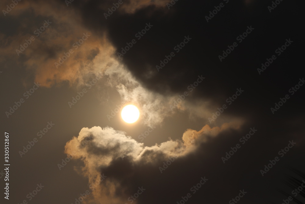 Obraz premium dramatic sky with clouds and sun