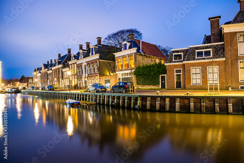 Harlingen, Netherlands - January 09, 2020. Traditional dutch houses at night