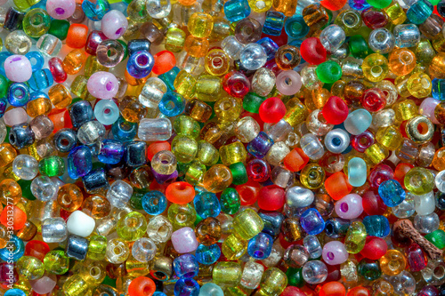 Macro photography of some colorful beads of different shape used for manufacturing jewerly and accesories.