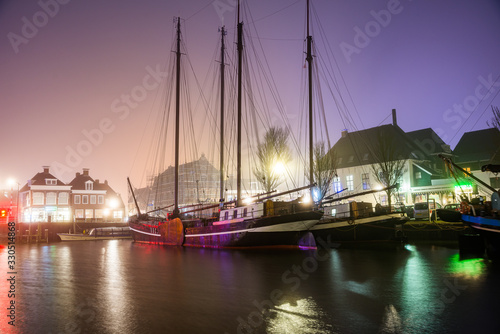 Harlingen  Netherlands - January 09  2020. Boat docked in downtown at night