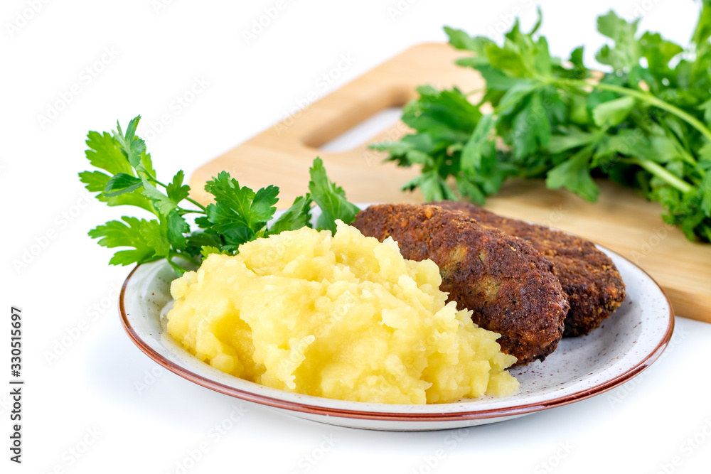 meatballs with mashed potatoes and parsley on a white background meatballs with mashed potatoes and parsley on a white background