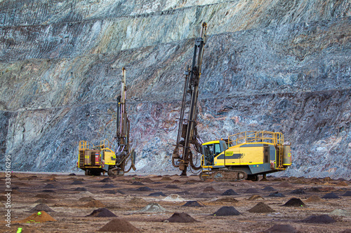 drill rigs on iron ore mine