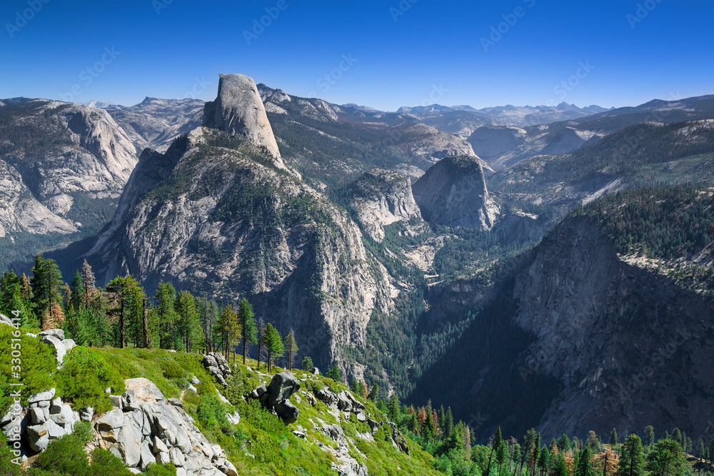 View of Half Dome in summer with blue sky, Yosemite National Park, USA